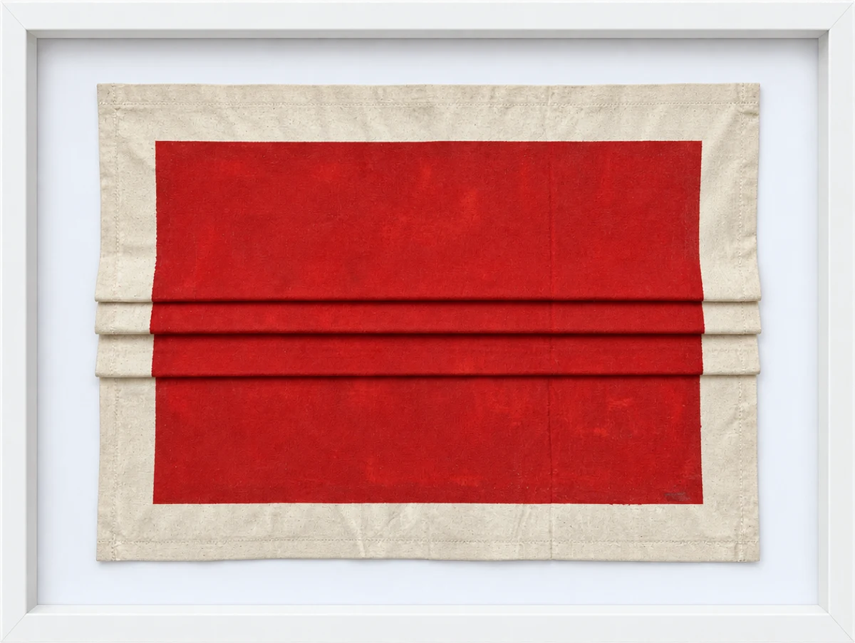 Framed folded linen with a red field