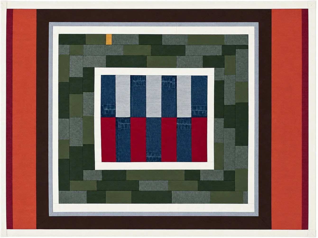 Patchwork quilt in rust, dark brown, green and denim